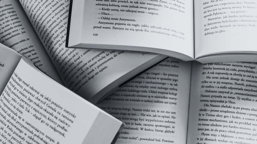 Thought-provoking Black And White Book On A Table Wallpaper