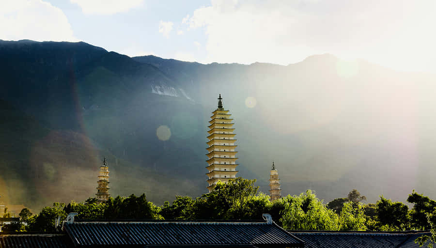 Three Pagodas With Lens Flare Wallpaper