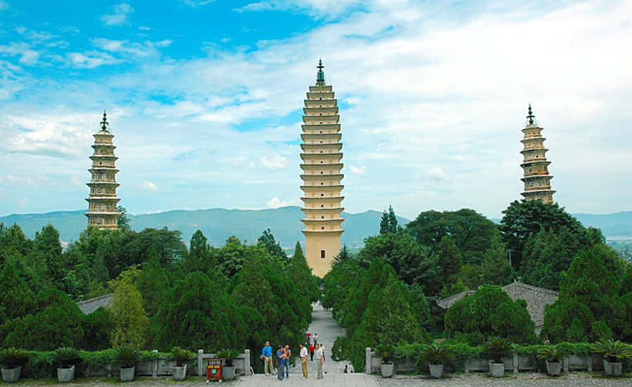 Three Pagodas With Tourists Wallpaper