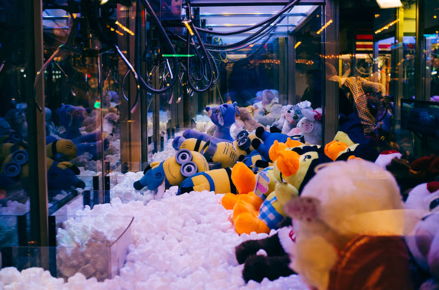 Three Playful Minions Enjoying Themselves Wallpaper