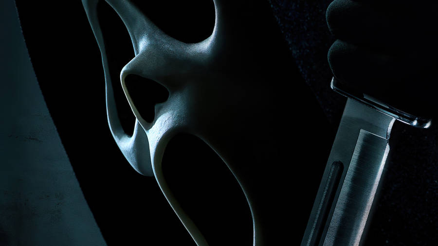 Thrilling Depiction Of Ghostface From The Scream Franchise Wallpaper