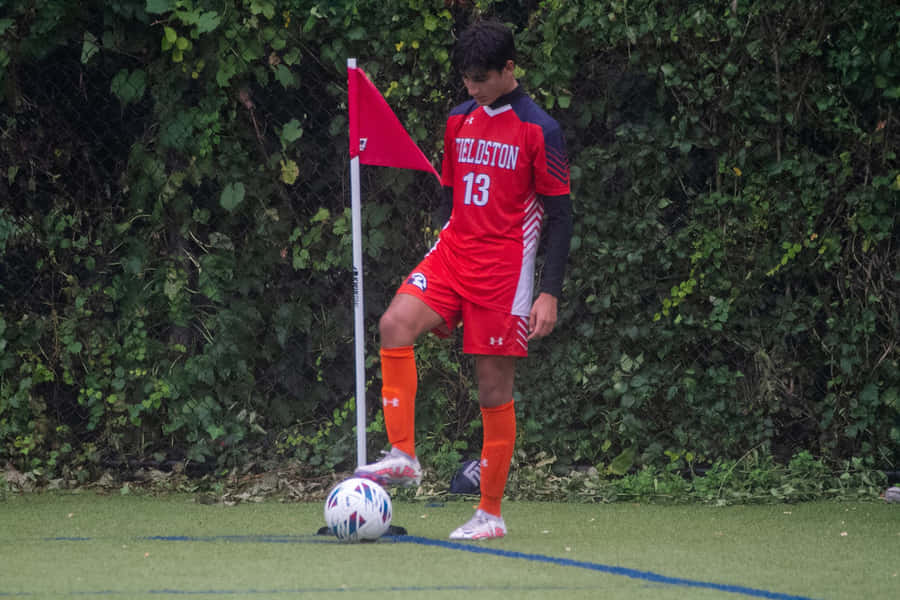 Thrilling Moment Of A Corner Kick In Football Wallpaper