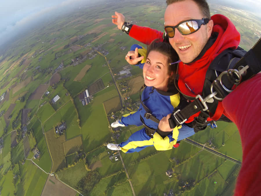 Thrilling Skydiving Selfie Over Lithuania Wallpaper