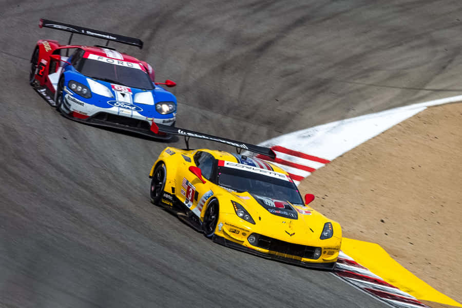 Thrilling Speed At The Racetrack Wallpaper