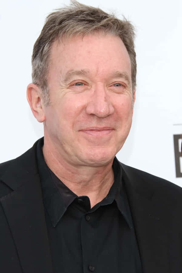 Tim Allen Posing For A Picture Wallpaper