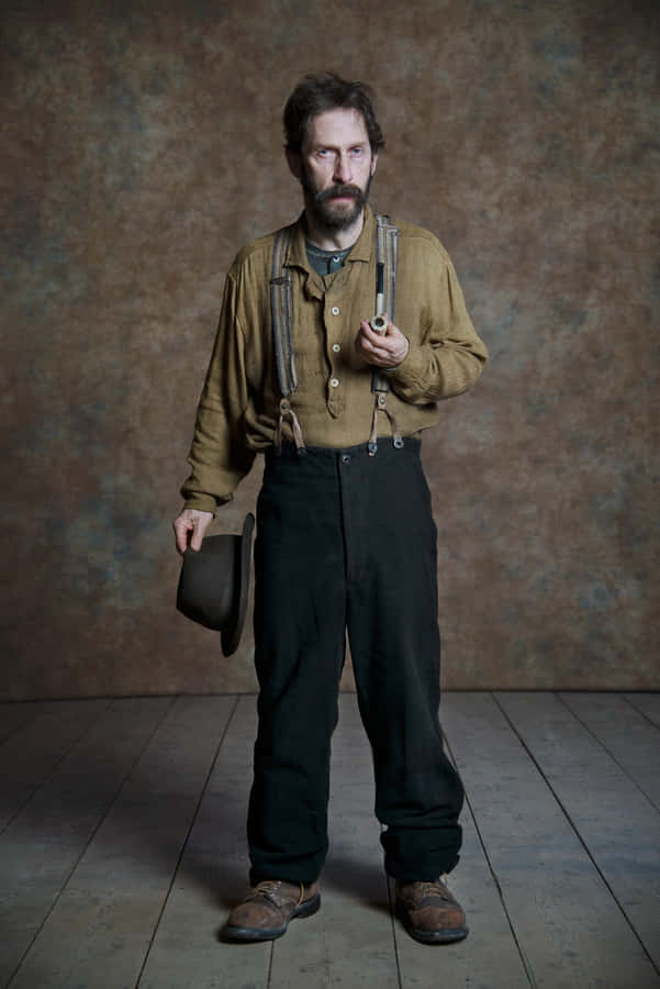 Tim Blake Nelson Posing For A Portrait Wallpaper