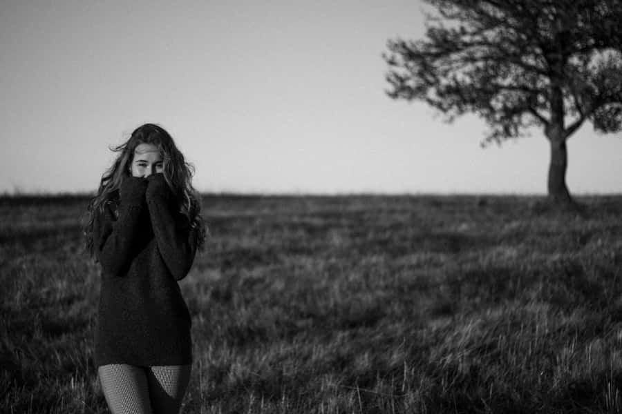 Timid Girlin Field Wallpaper