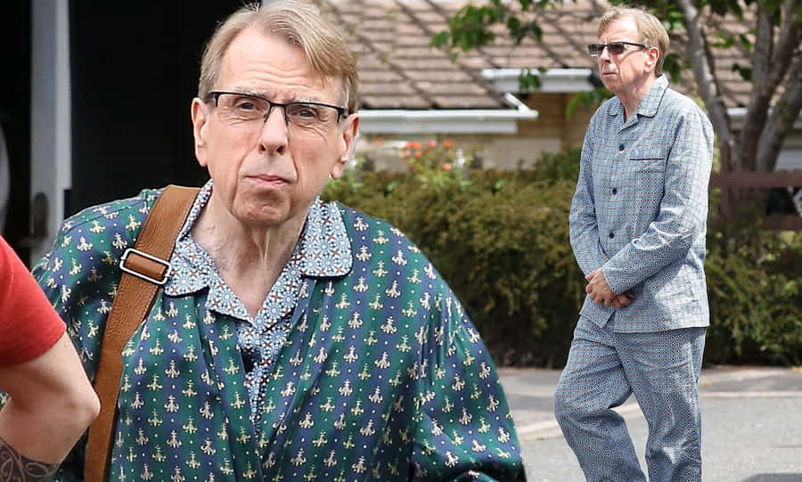 Timothy Spall Smiling In A Pensive State Wallpaper