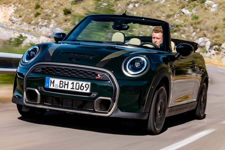 Top-down Cruising In A Sleek Mini Cooper S Convertible Wallpaper