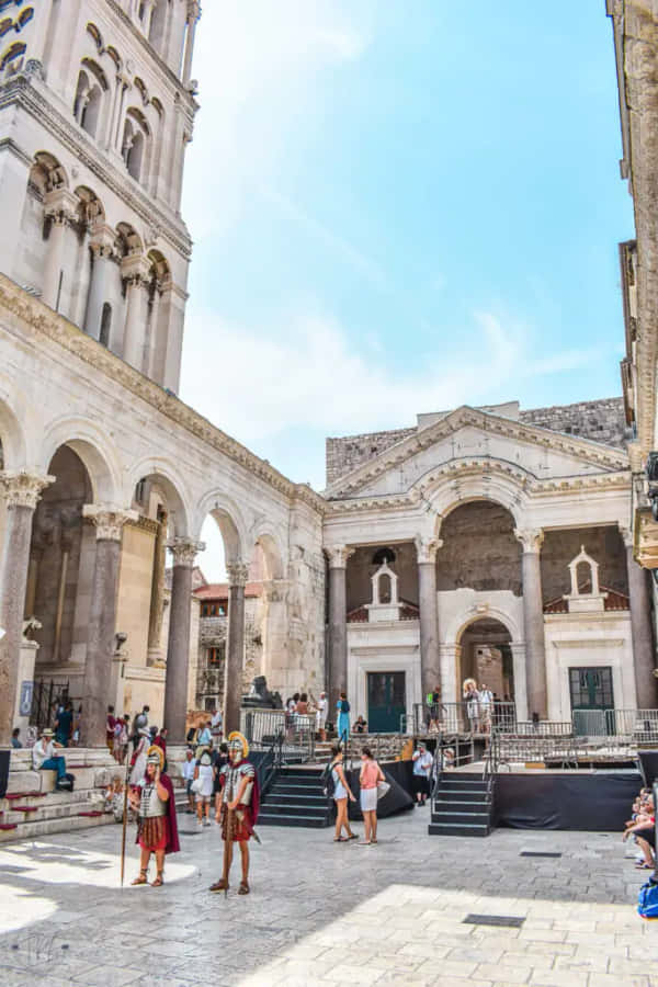 Tourists Exploring Historical Diocletian's Palace, Croatia Wallpaper