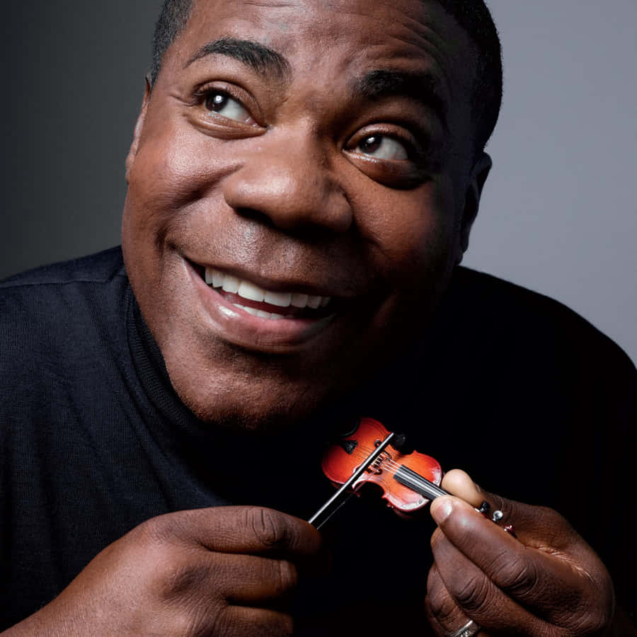 Tracy Morgan Striking A Pose During A Photoshoot Wallpaper