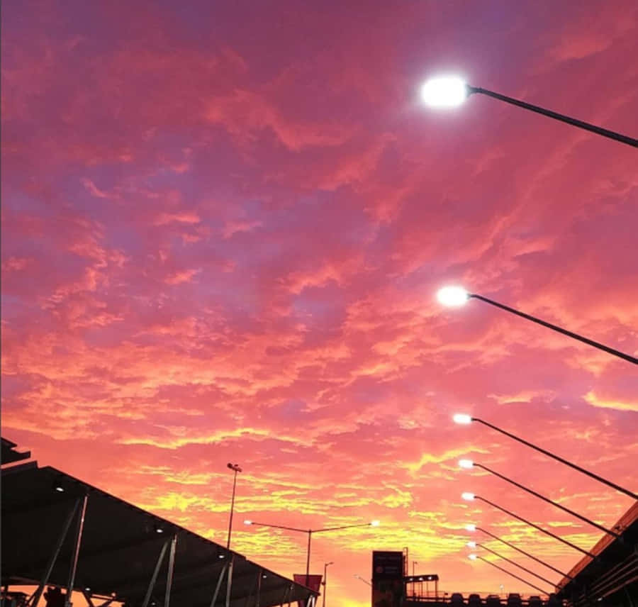 Tranquil Pink Sky At Sunset Wallpaper