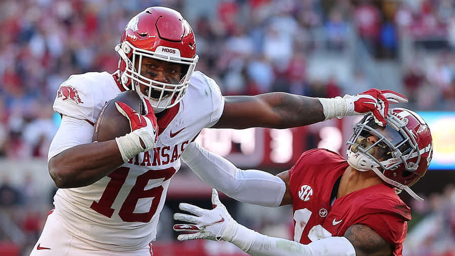 Treylon Burks In Action Against Defender Wallpaper