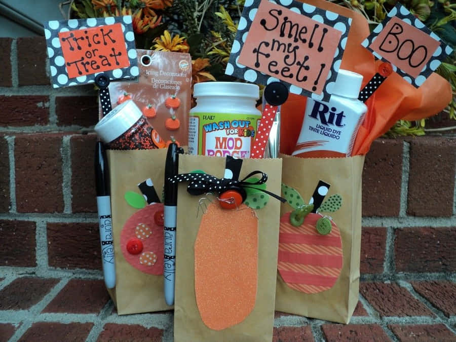 Trick-or-treat Bags Filled With Candy And Fun Decorations Wallpaper