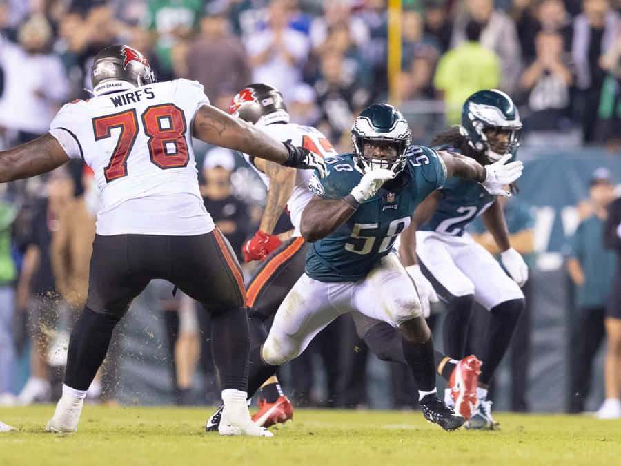 Tristan Wirfs Blocking During N F L Game Wallpaper