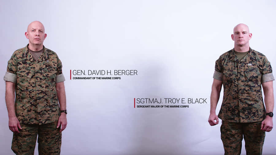 Two Men In Military Uniforms Standing Next To Each Other Wallpaper