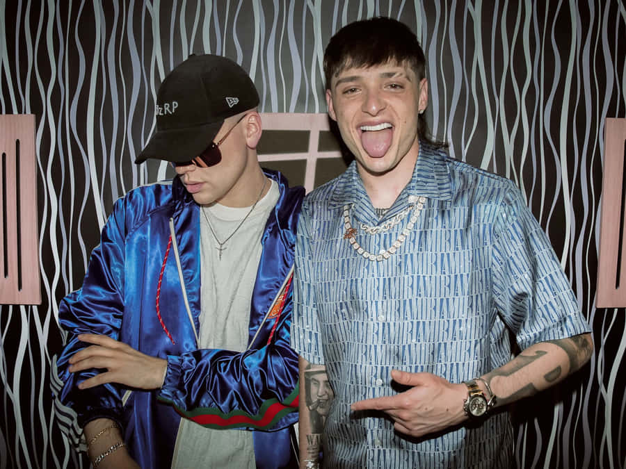 Two Men Party Attire Zebra Background Wallpaper