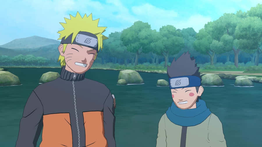 Two Naruto Characters Standing Next To A River Wallpaper