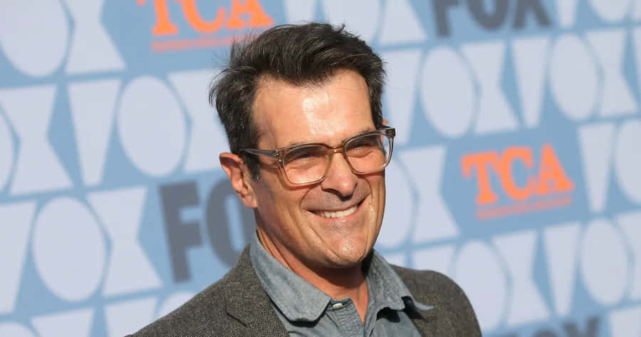 Ty Burrell Smiling During An Interview Wallpaper