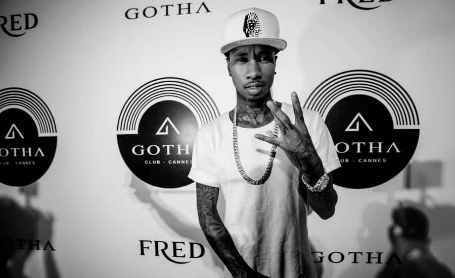 Tyga Poses In A Red Leather Jacket Wallpaper