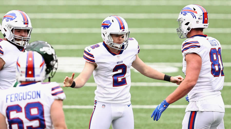 Tyler Bass Celebratingwith Teammates Wallpaper