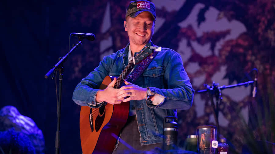 Tyler Childers Live Performancewith Guitar Wallpaper