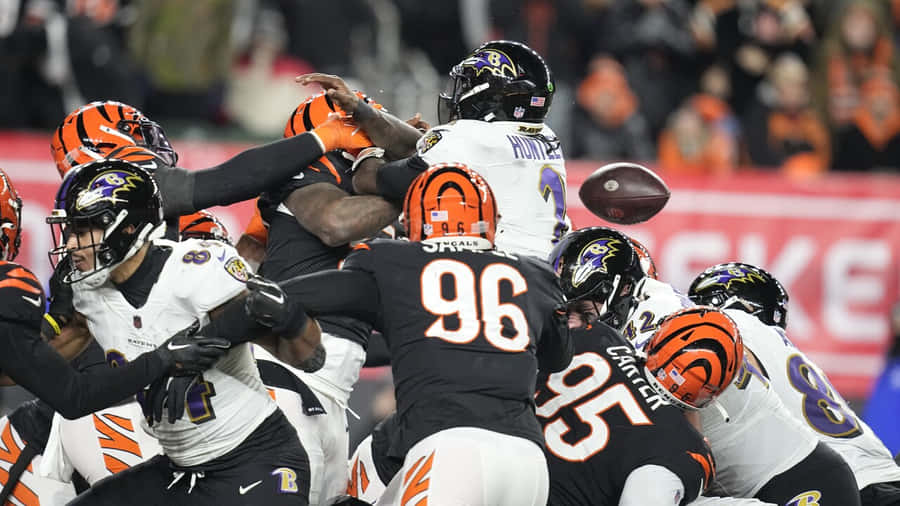 Tyler Huntley Evasive Maneuver During Game Wallpaper