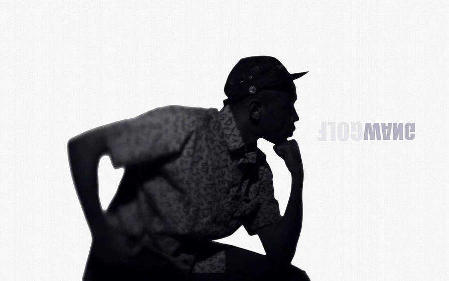 Tyler The Creator In Thoughtful Contemplation Wallpaper