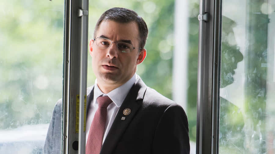 U.s. Representative Justin Amash At The Podium Wallpaper