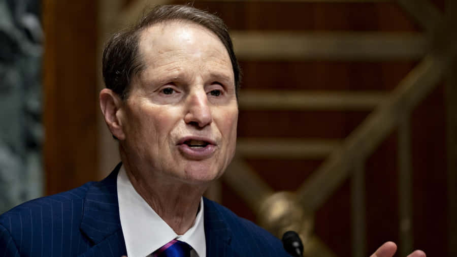 U.s. Senator Ron Wyden Speaking At An Event Wallpaper