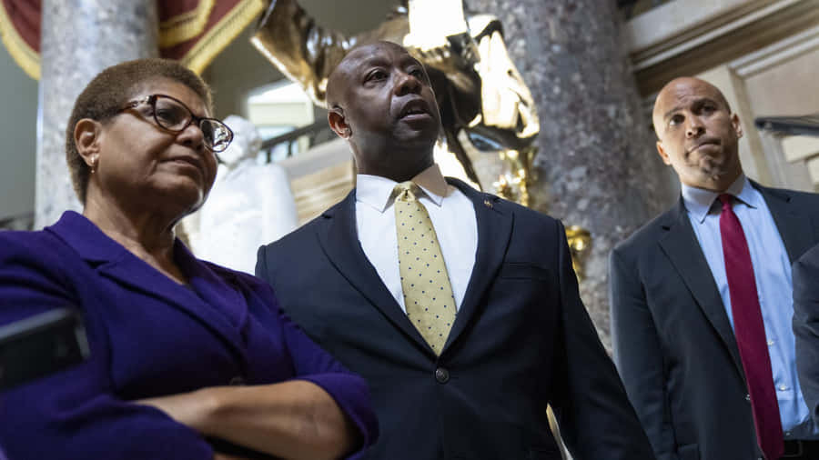 U.s Senators Tim Scott, Cory Booker, And Representative Karen Bass Engaged In Deep Discussion Wallpaper