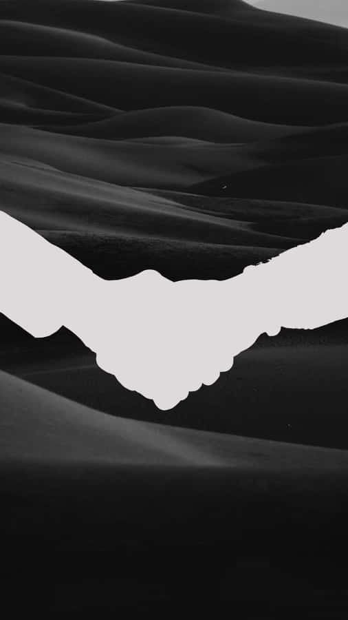 Uniting In Trust - A Black And White Handshake Wallpaper