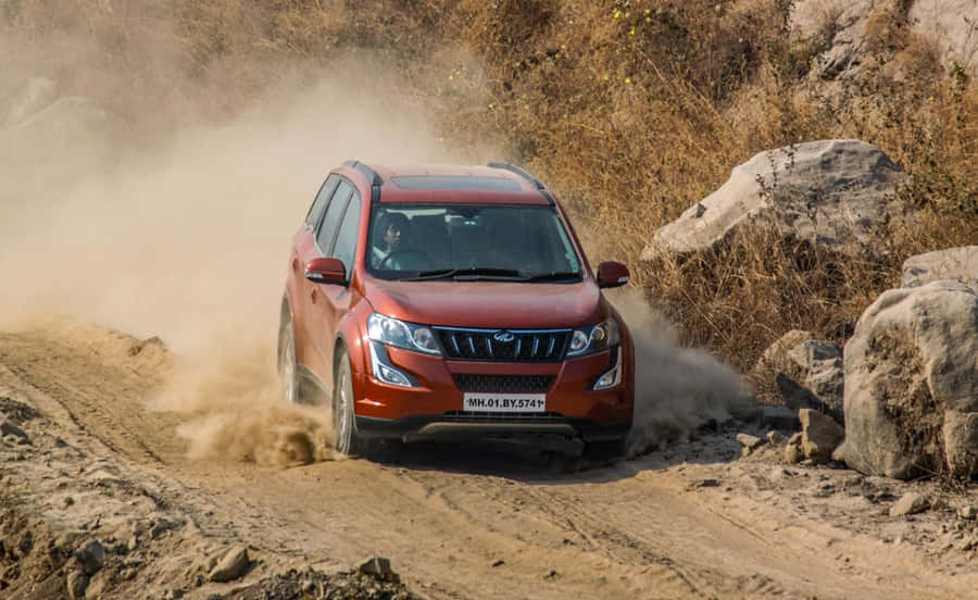 Unleash The Beast - Majestic Mahindra Xuv500 On The Move Wallpaper