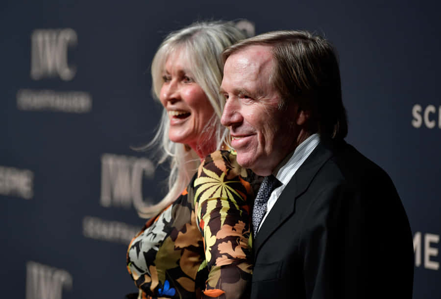 Veteran German Football Günter Netzer With Elvira Lang Netzer Photograph Wallpaper