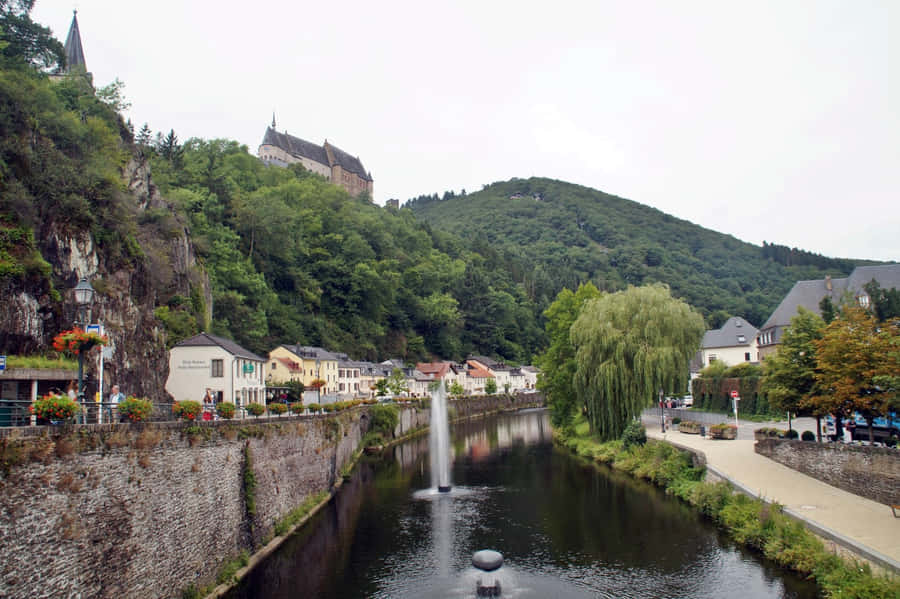 Vianden Castle Overlooking River Town Wallpaper