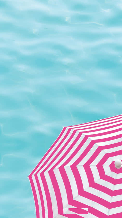 Vibrant Beach Umbrella In The Sun Wallpaper
