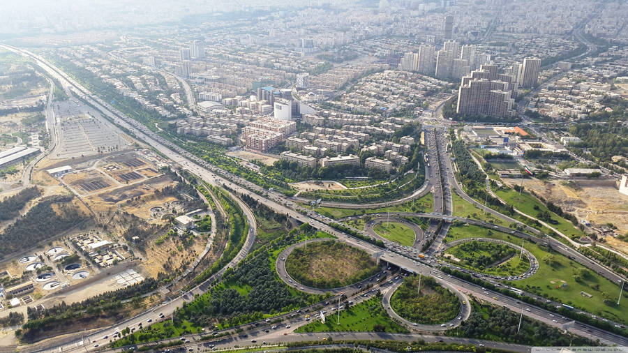Vibrant Night Scene Of Tehran Road Loops Wallpaper