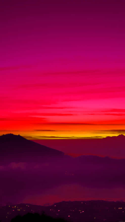 Vibrant Pink Orange Sunset Mountain Silhouette Wallpaper