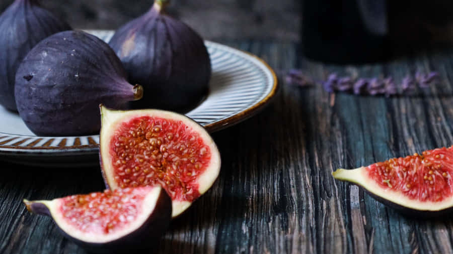 Vibrant Purple Figs Offering A Burst Of Color Wallpaper