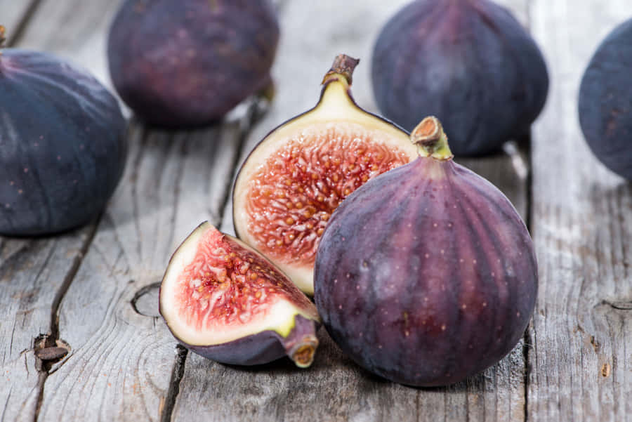 Vibrant Purple Figs, Ripe And Ready To Enjoy. Wallpaper
