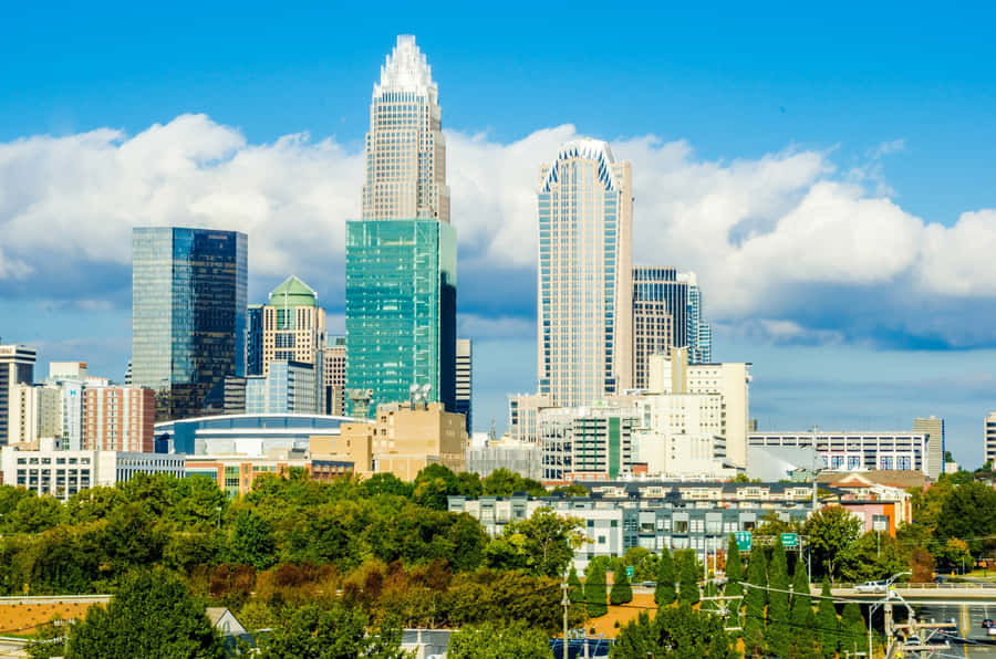 Vibrant Skyline Of Charlotte, North Carolina At Dusk Wallpaper