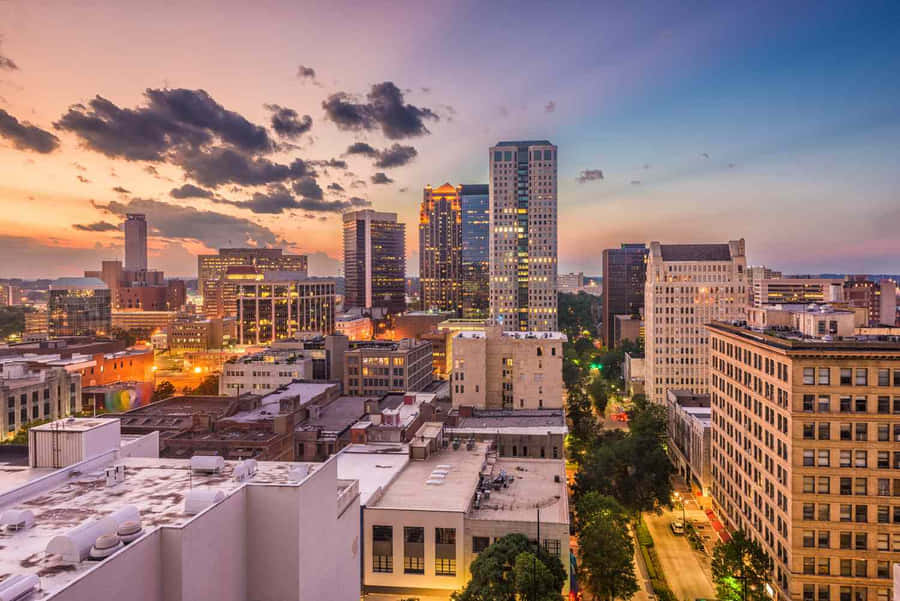 Vibrant Sunset Over Montgomery Skyline Wallpaper