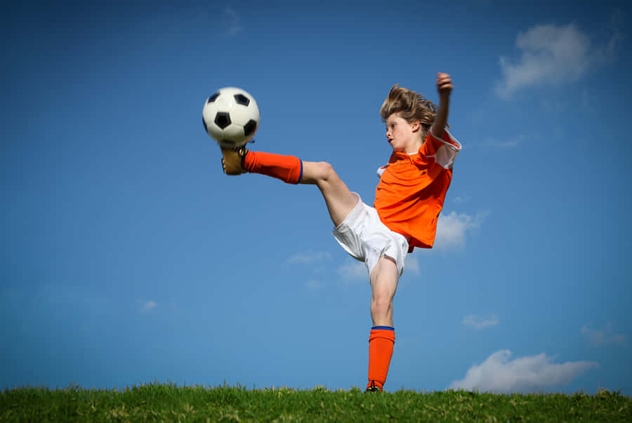 Vibrant Thrill Of Children's Soccer Wallpaper