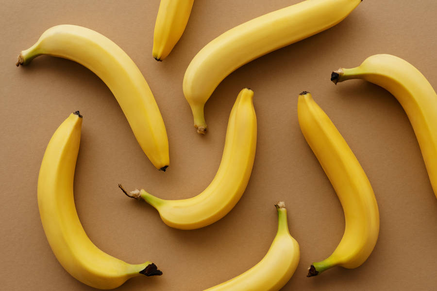 Vibrant Yellow Bananas In Disarray Wallpaper
