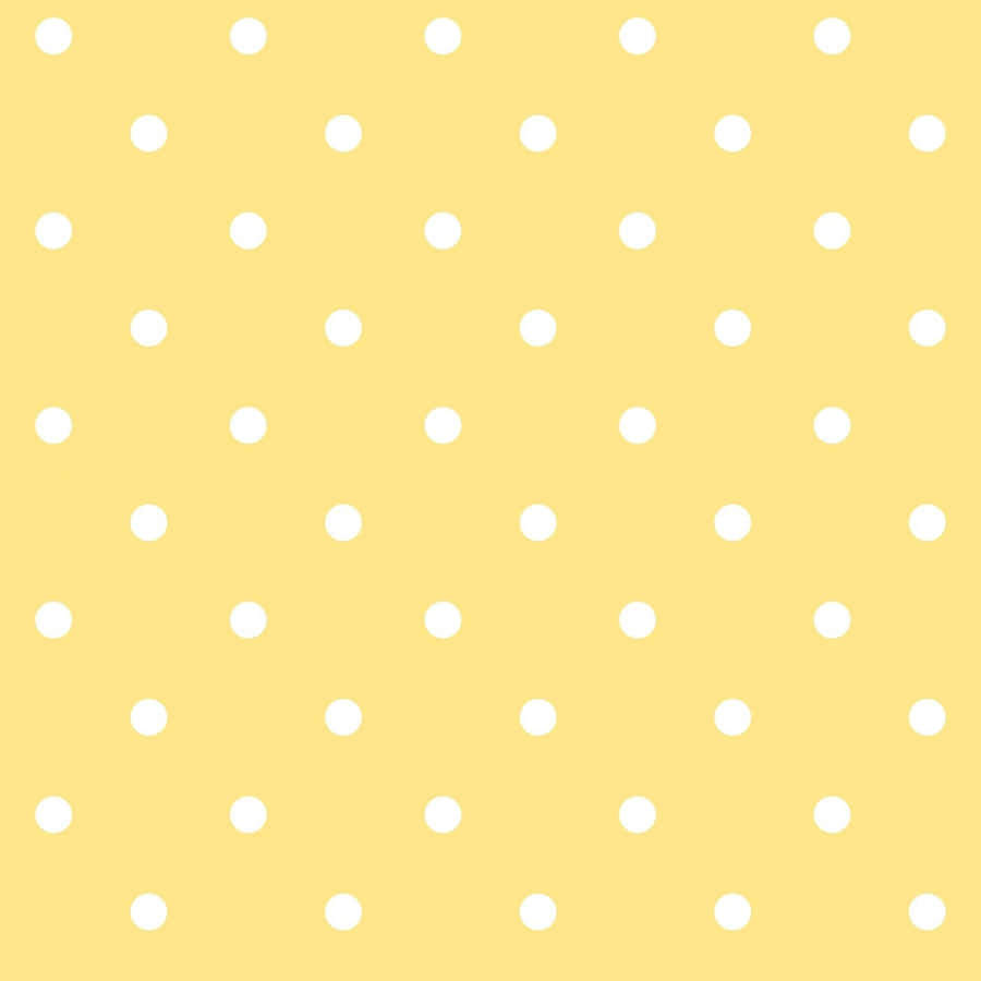 Vibrant Yellow Polka Dot Background Wallpaper