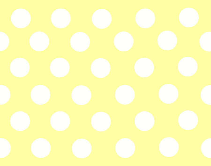 Vibrant Yellow Polka Dot Background Wallpaper