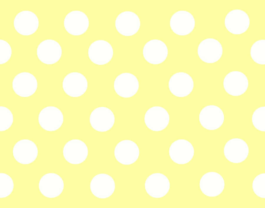 Vibrant Yellow Polka Dot Background Wallpaper