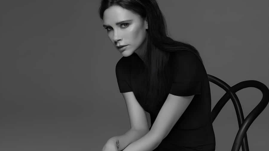 Victoria Beckham Elegant Black Dress Wallpaper