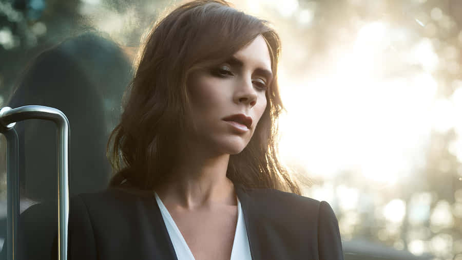 Victoria Beckham Stylish Outdoor Portrait Wallpaper