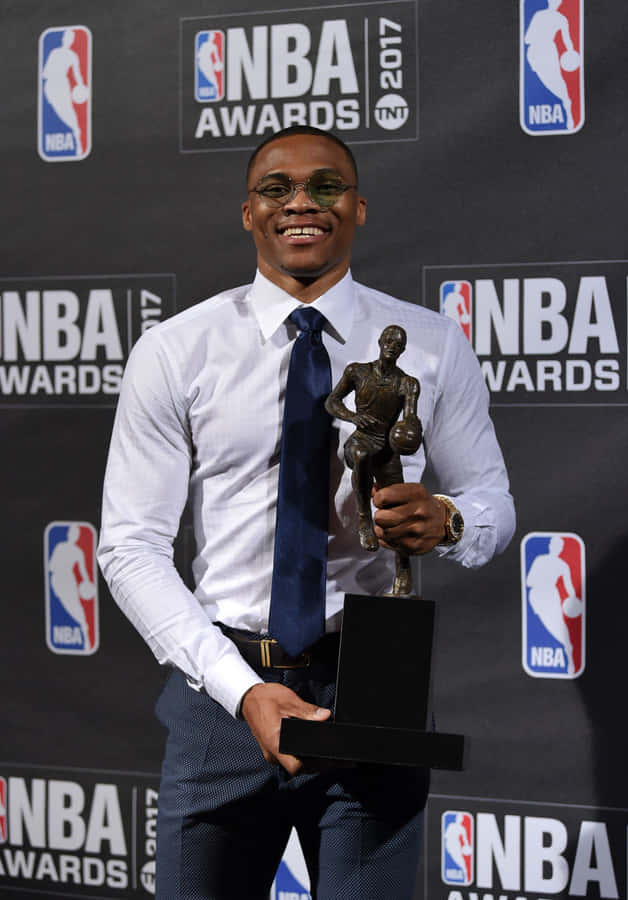 Victorious Nba Player Holding His Award With Pride Wallpaper